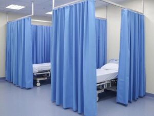 Durable hospital curtain providing privacy and maintaining a sterile environment.